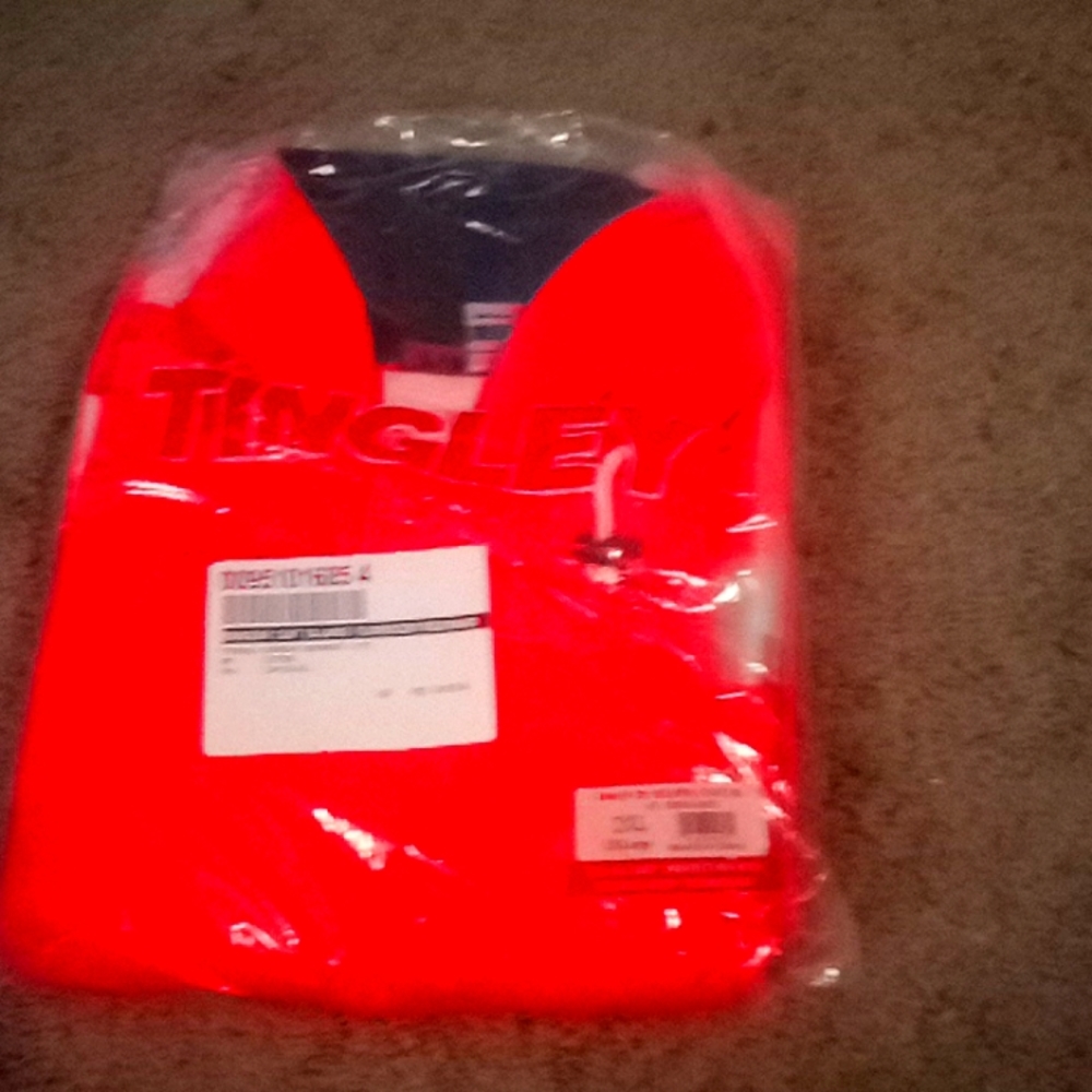 Tingly rain coat new in plastic 2XL